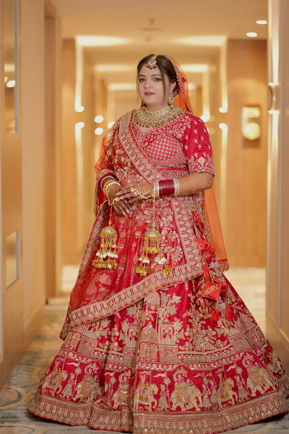 Bride in red lehenga photographed by Magic Click